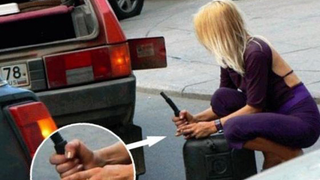 A Blonde, Her Cigarette And A Gas Can